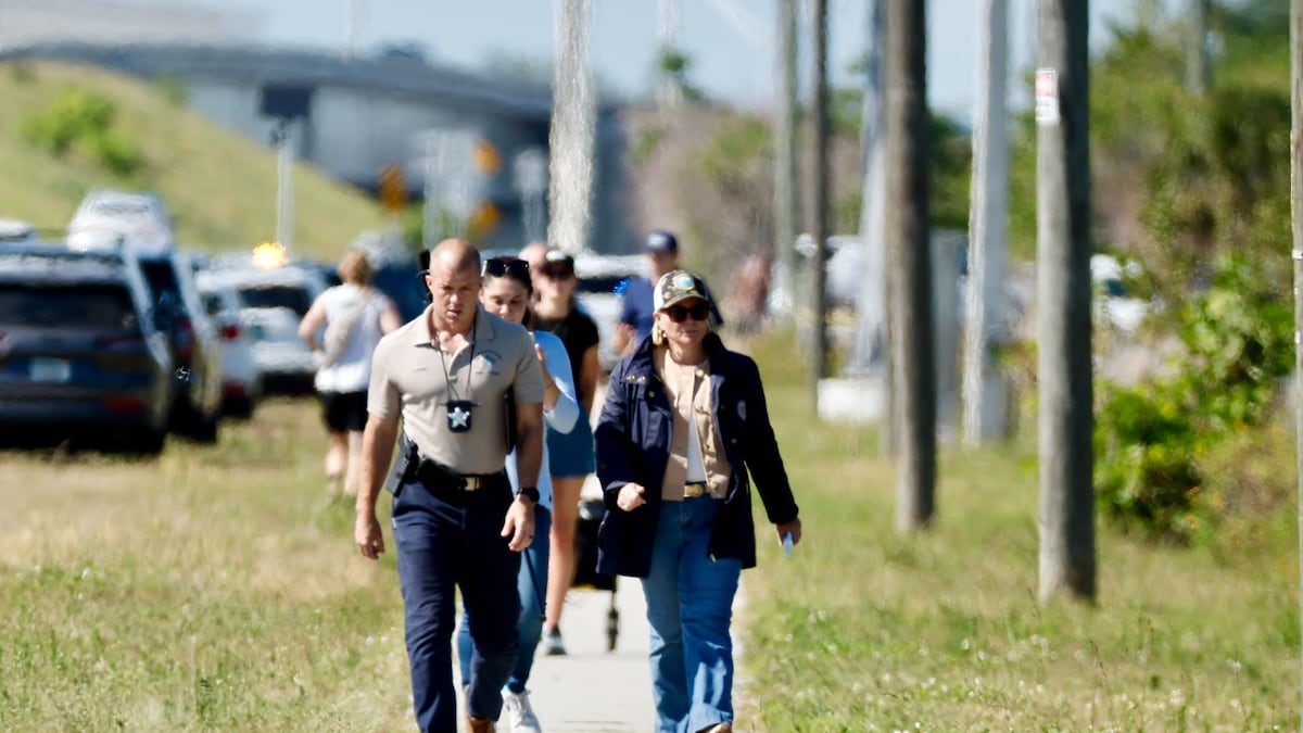 Law enforcement gathered near where divers searched for missing USF ...