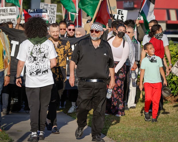 Hatem Naji Fariz, center, is seen during a pro-Palestinian rally May 1 in Tampa. Hatem Naji Fariz, center, is seen during a pro-Palestinian rally May 1 in Tampa.