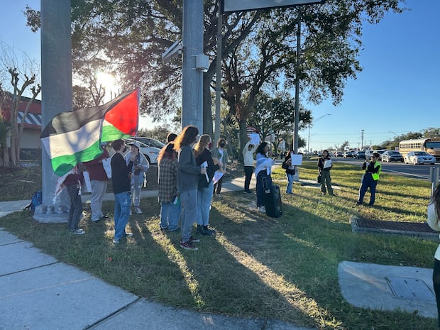 Protesters gather at the intersection of 56th Street and Fowler Ave. in Tampa after  facing restrictions on protesting on campus.