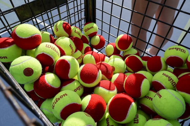 Tennis balls for the Little Hawks tennis class await action at Hillsborough College's tennis center on March 4 in Tampa. 