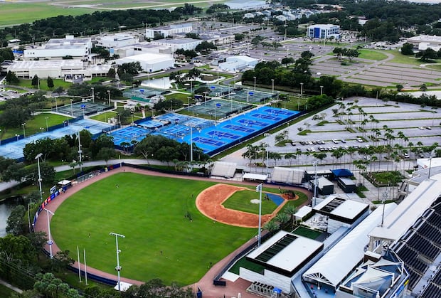 This drone view of Hillsborough College's Dale Mabry campus, on left in background, shows the blue tennis and pickleball courts near a baseball practice facility. 