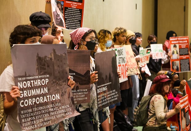 University of South Florida student demonstrators watch as members of their group address the board of trustees on March 18 in Tampa. Some of the students later started a hunger strike over their demands that USF divest from Israel.